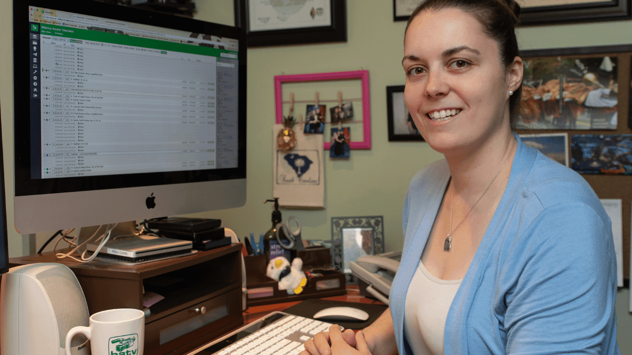 Kayla Creamer of Billerica Access TV poses for a picture while using Cablecast video automation software