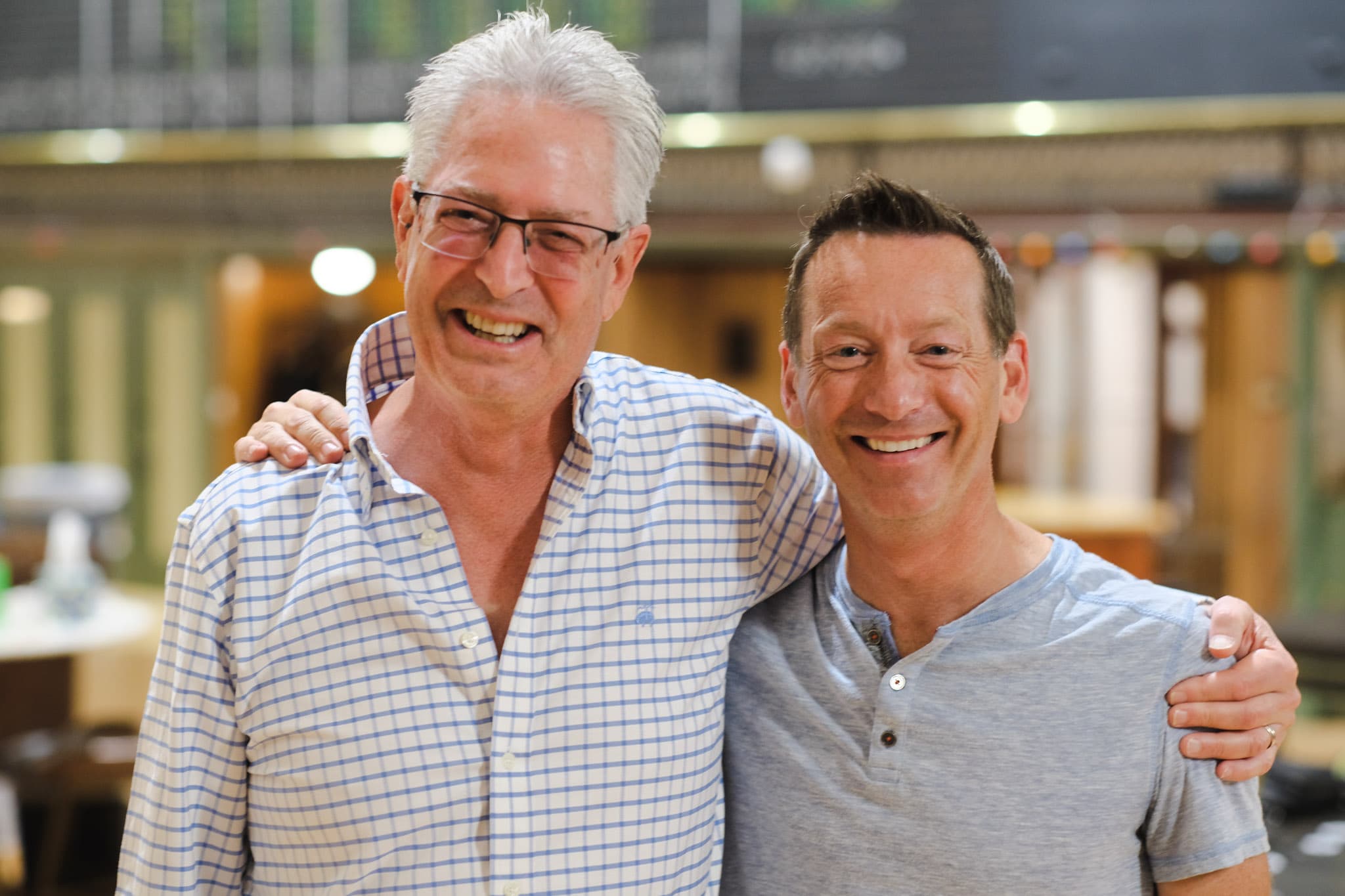 Steve Israelsky, President of Cablecast and JJ Parker, CEO of Cablecast smile for a photo at Steve's Retirement Party