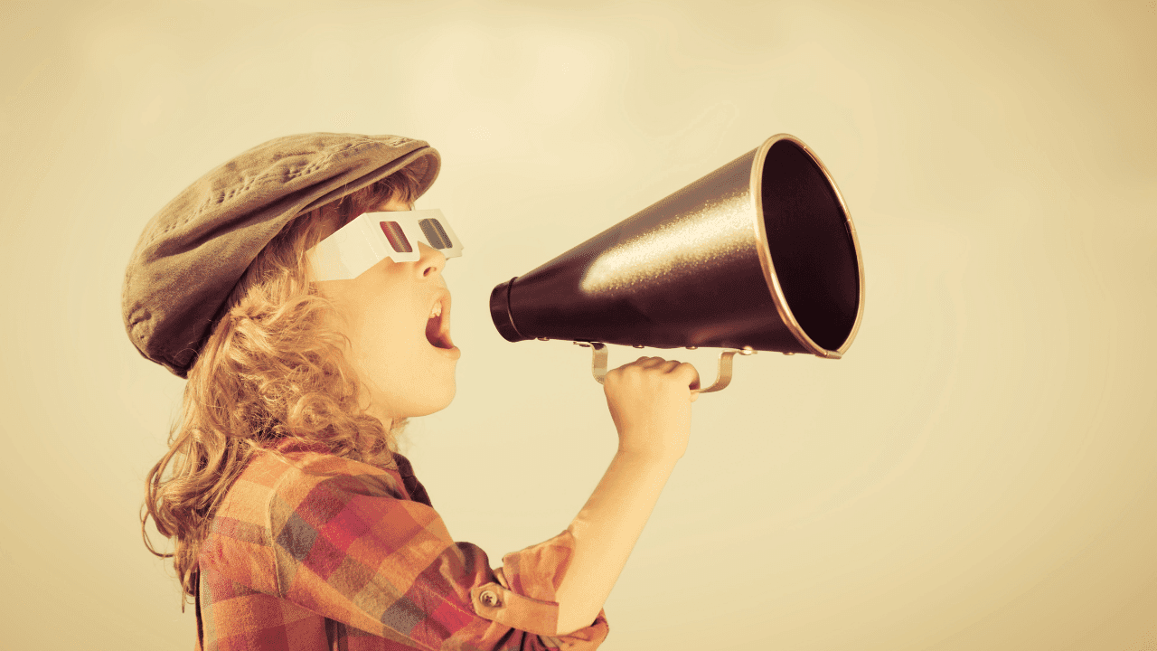 A child speaks through a megaphone