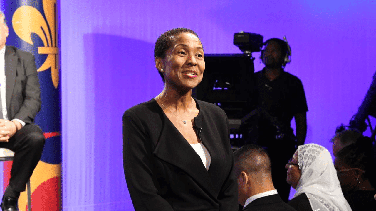 A person speaks while giving a speech at a community event