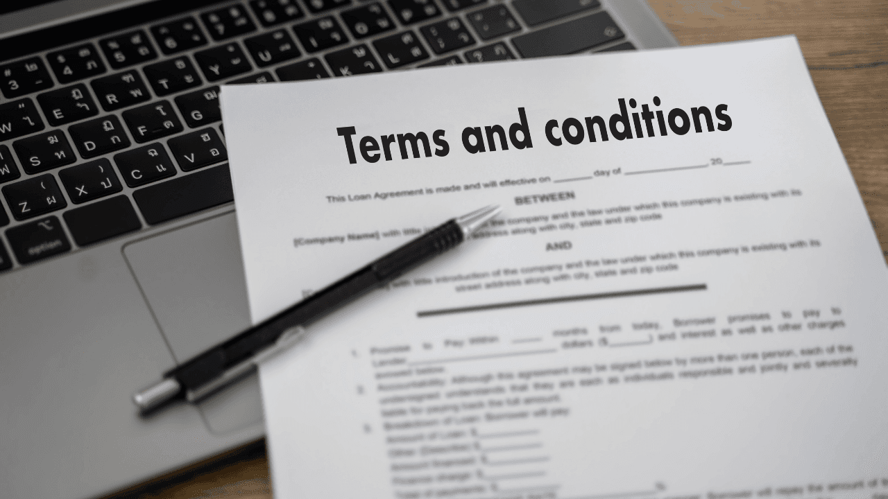 Terms and Conditions paperwork on an office desk