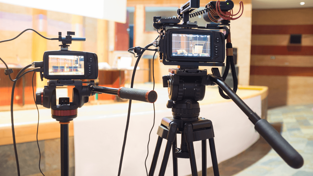 A couple of professional video filming cameras in studio production