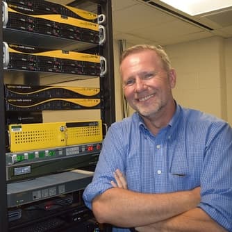 James City County - Person posing by Tightrope Media System Video Automation Servers