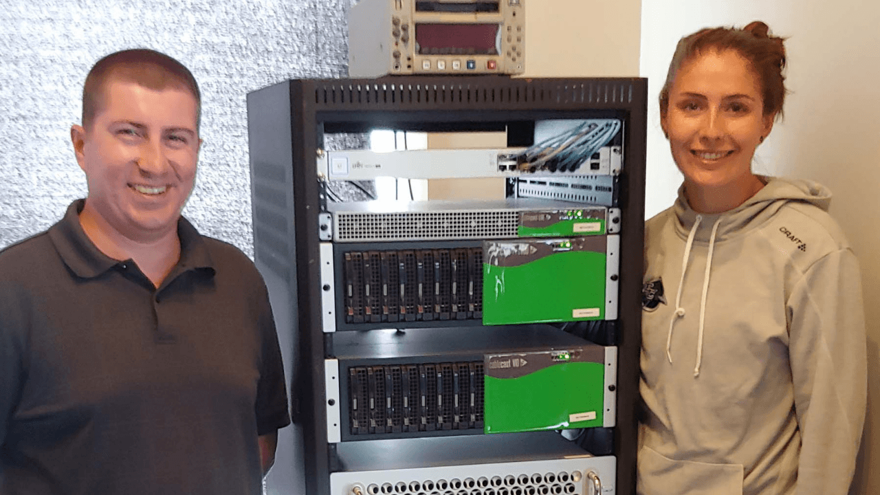 Valley Shore Team standing by Cablecast servers in studio